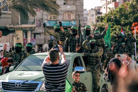 Hamas militants parade at a rally just over a week after a cease-fire was reached in an 11-day war between Hamas and Israel.